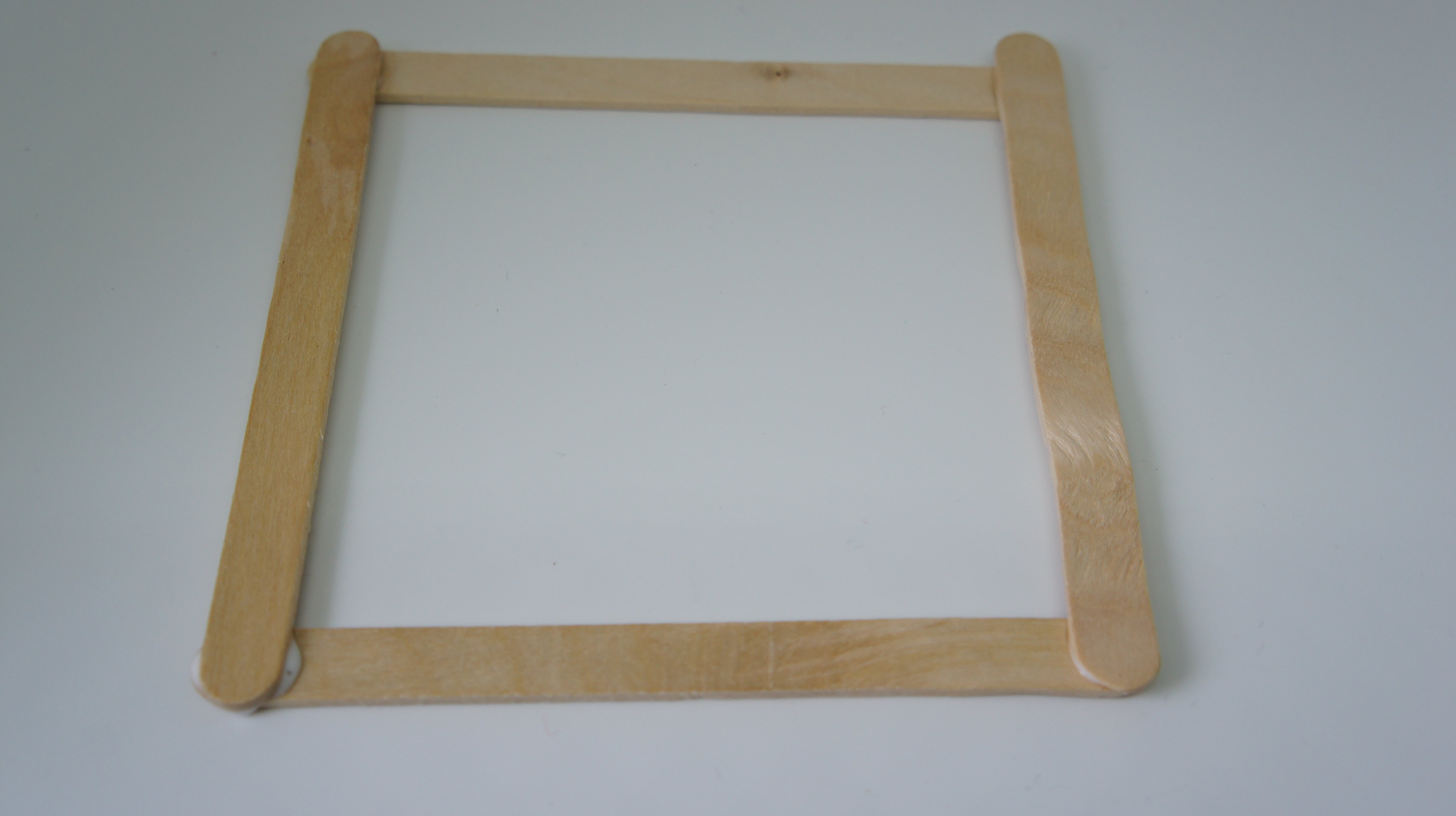 Craft sticks glued into frame shape