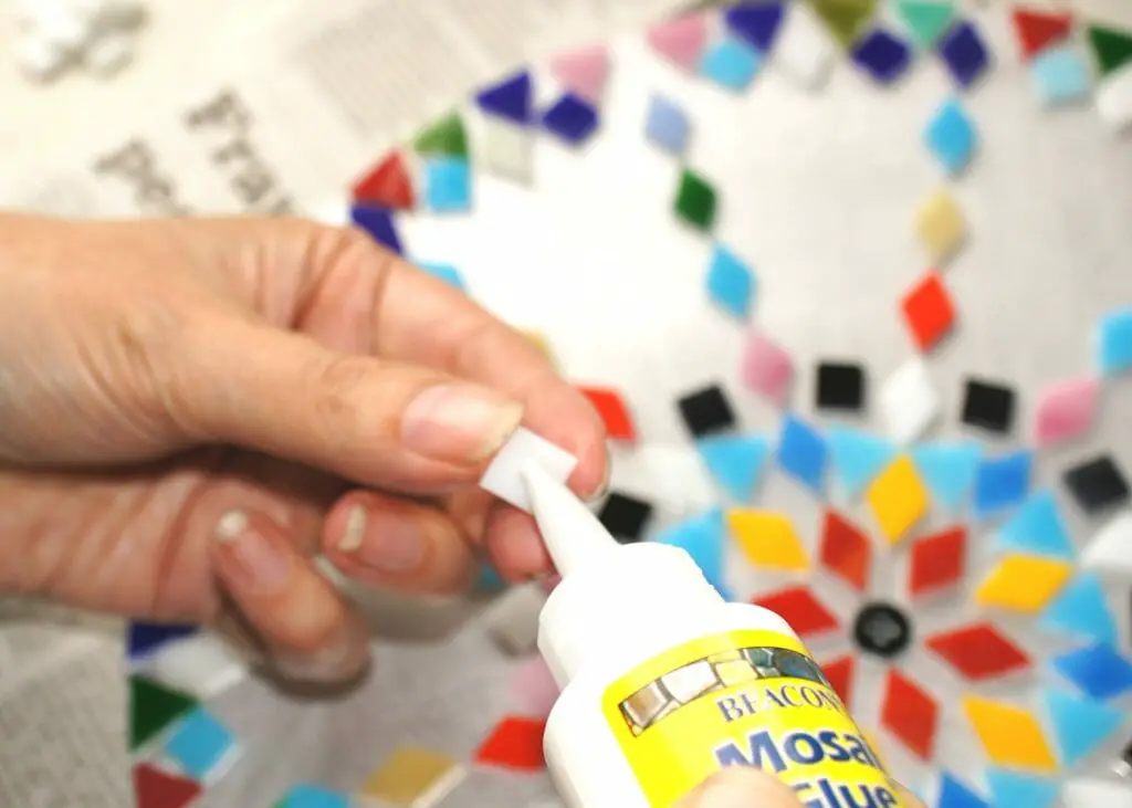 Applying glue to tile