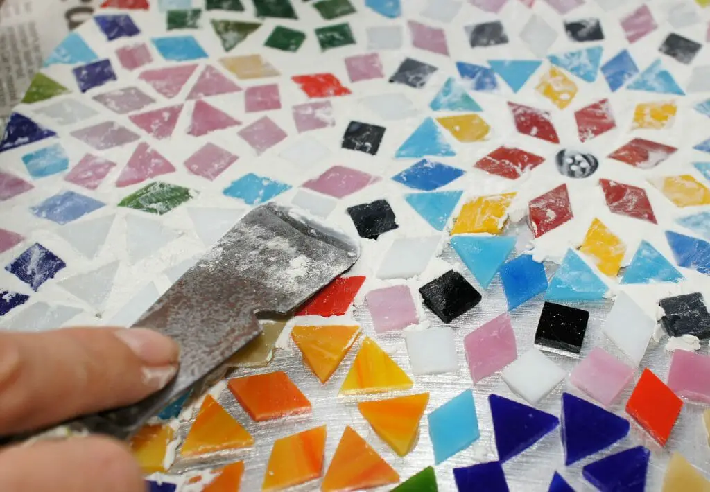 Grouting the mosaic table