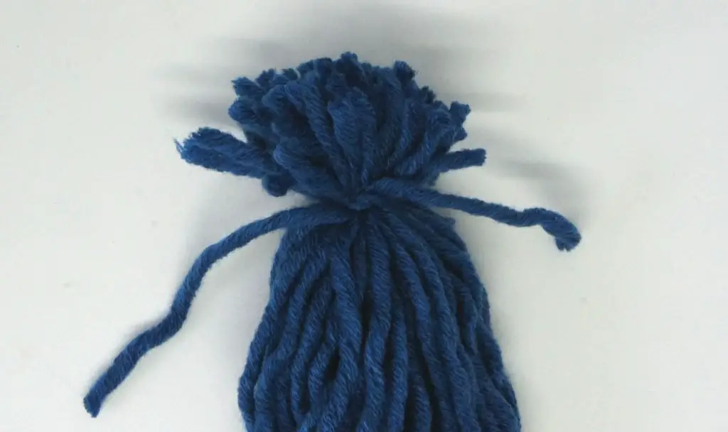 Hair on yarn doll
