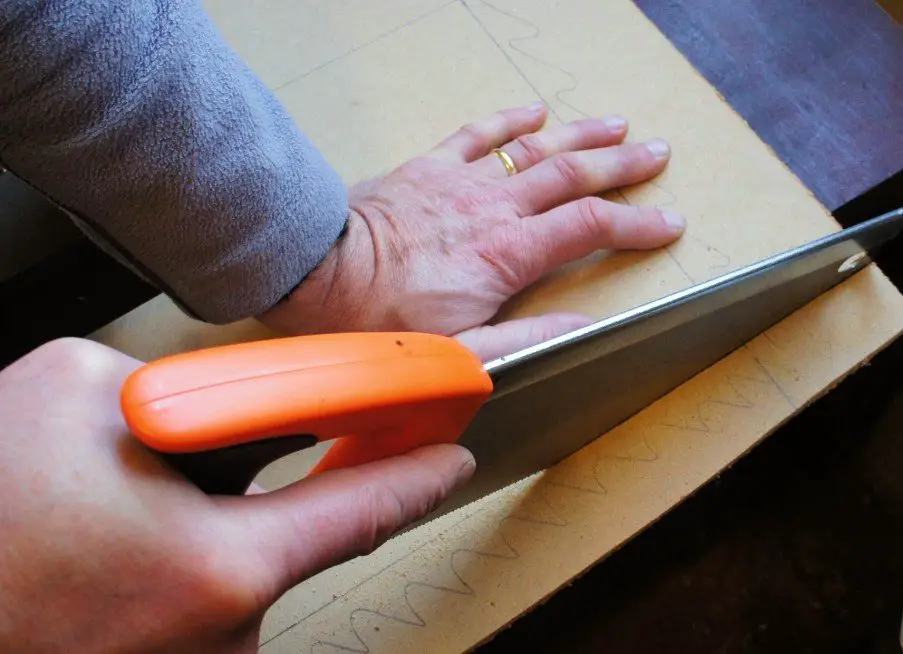 Sawing wood for flower press