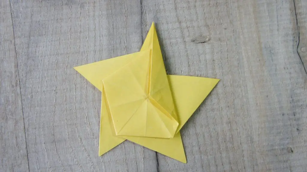 Fold onto front of star