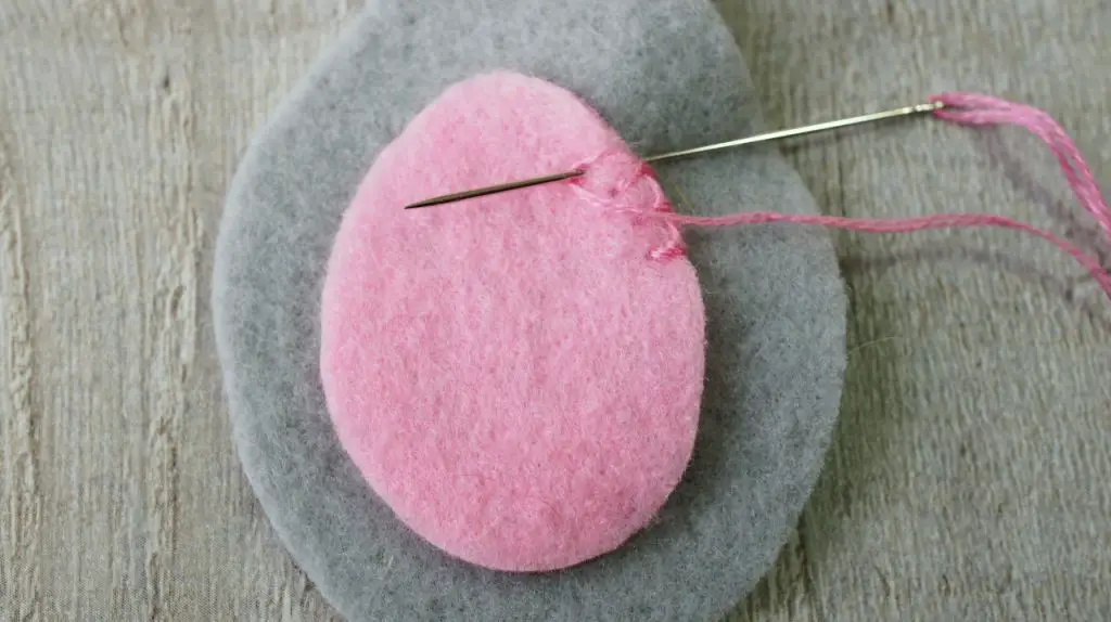 sewing tummy onto felt rabbit closeup