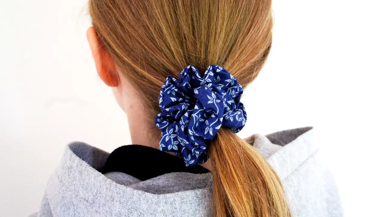 blue flowery scrunchie in hair