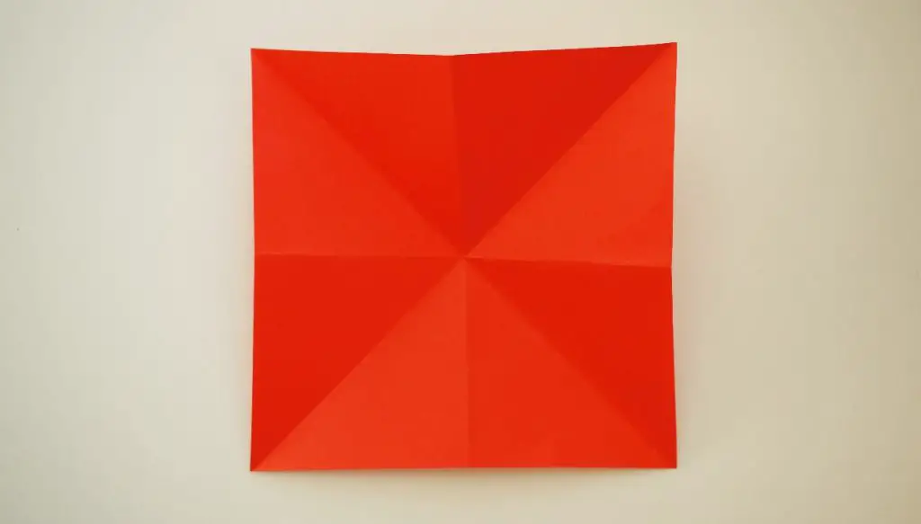 square of paper folded and then opened out