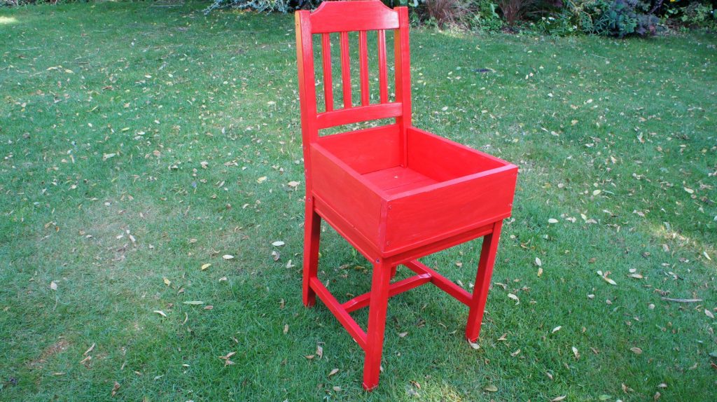 Chair painted red for succulent garden idea

