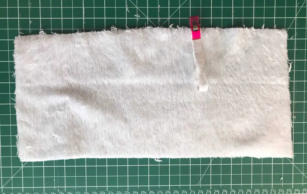 ribbon pinned to rectangle of toweling