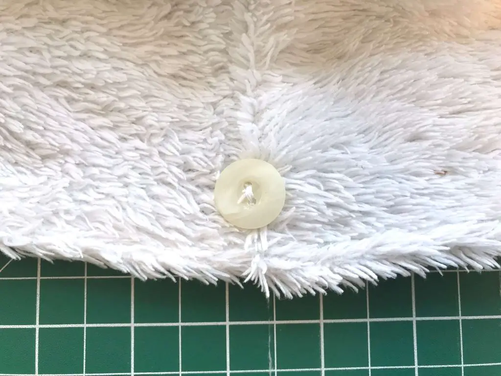 button sewn onto the hair towel wrap