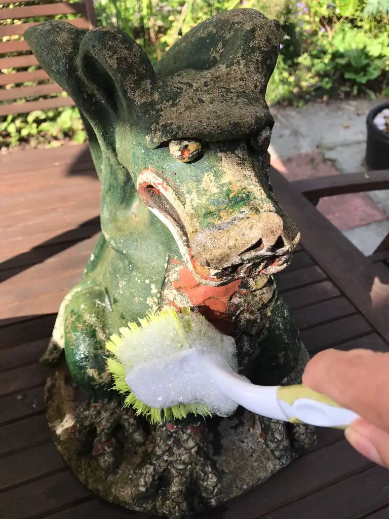 garden ornament being cleaned