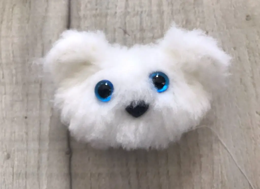 cat puppet head with eyes and nose added