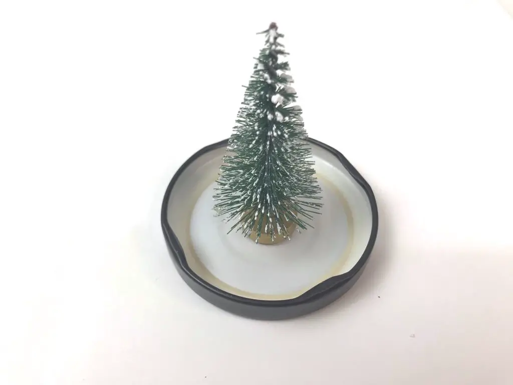 Christmas tree stuck onto jar lid
