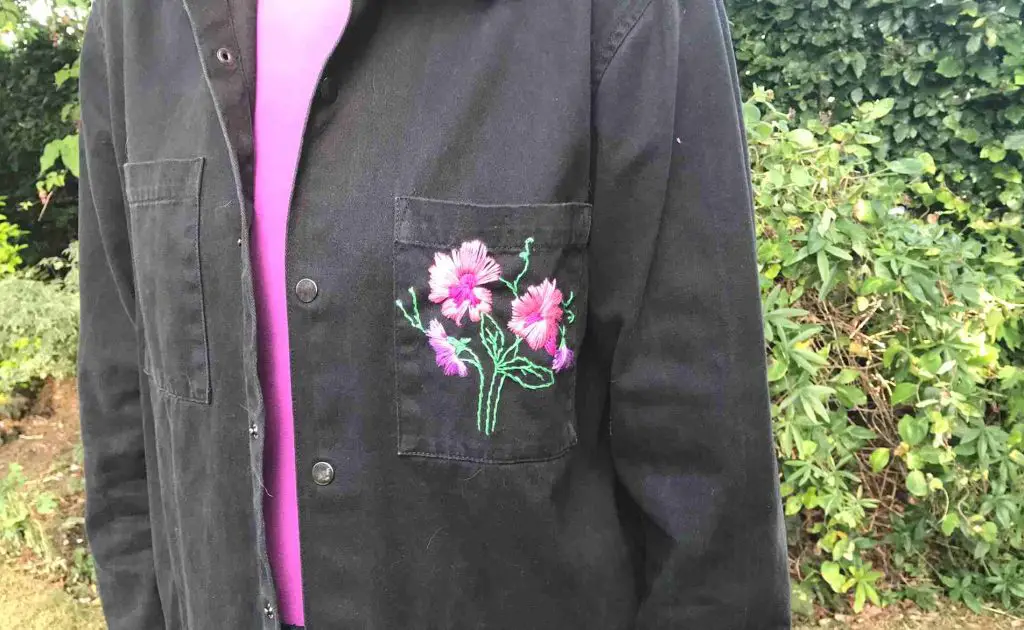 embroidery detail on denim jacket upcycle