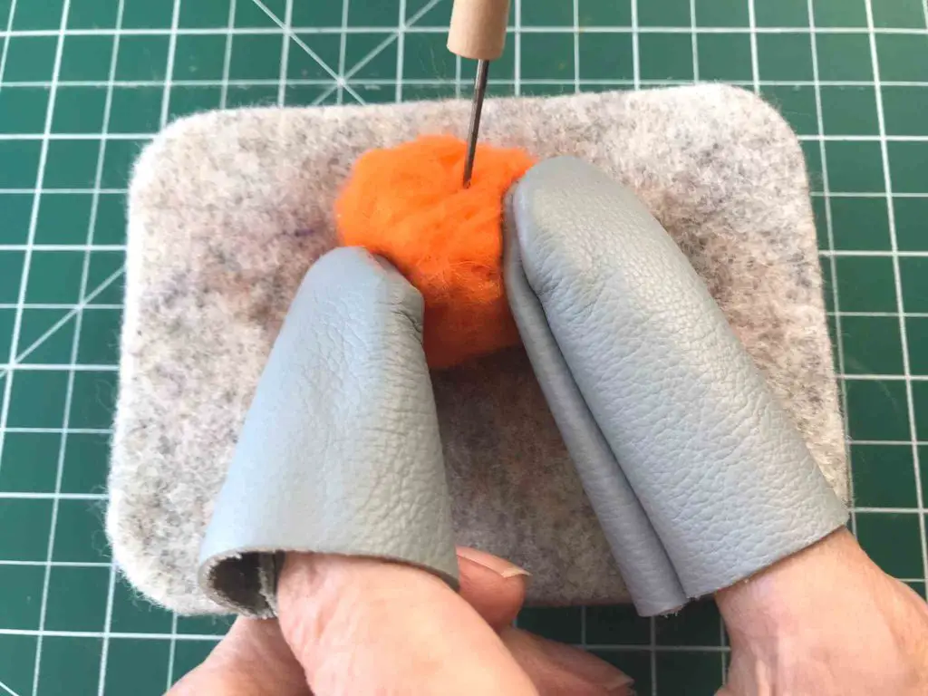 using finger guards in needle felting