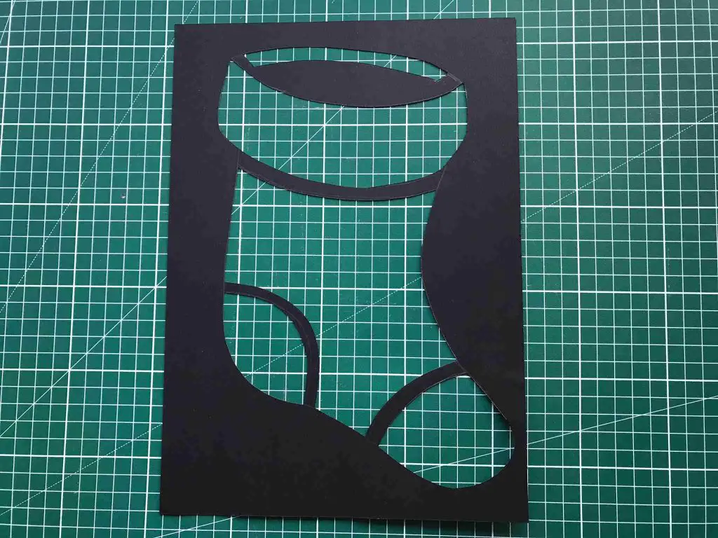 Christmas stocking stained glass cut out of black paper