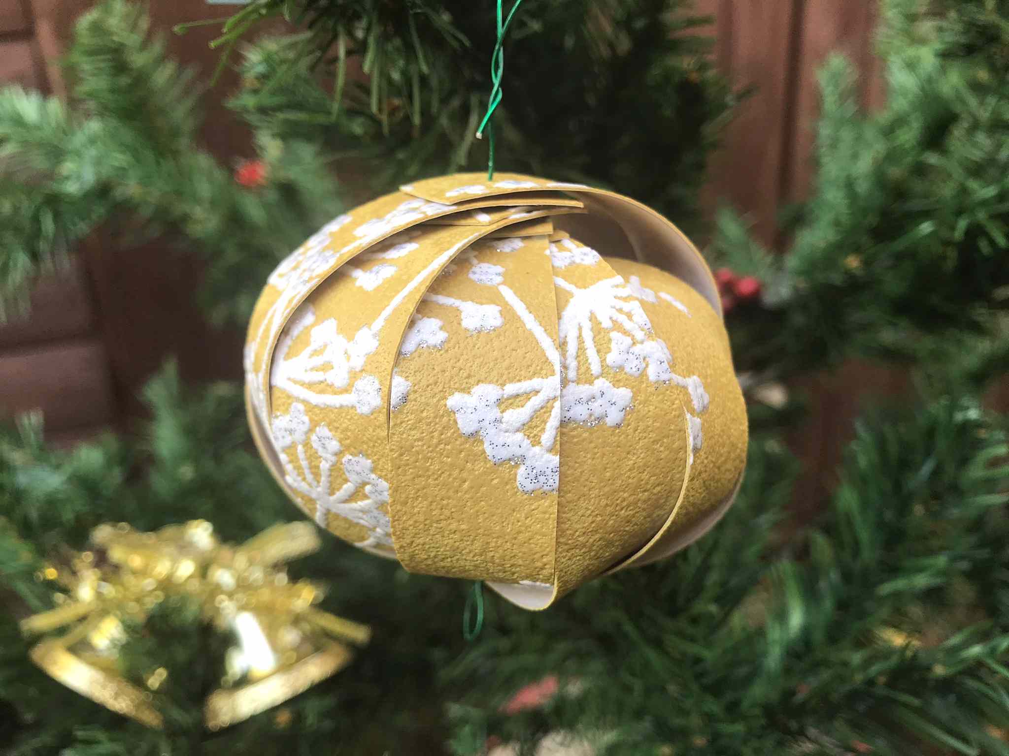 yellow paper bauble made using wallpaper