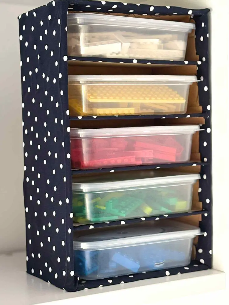 completed shoebox storage unit with Lego in it