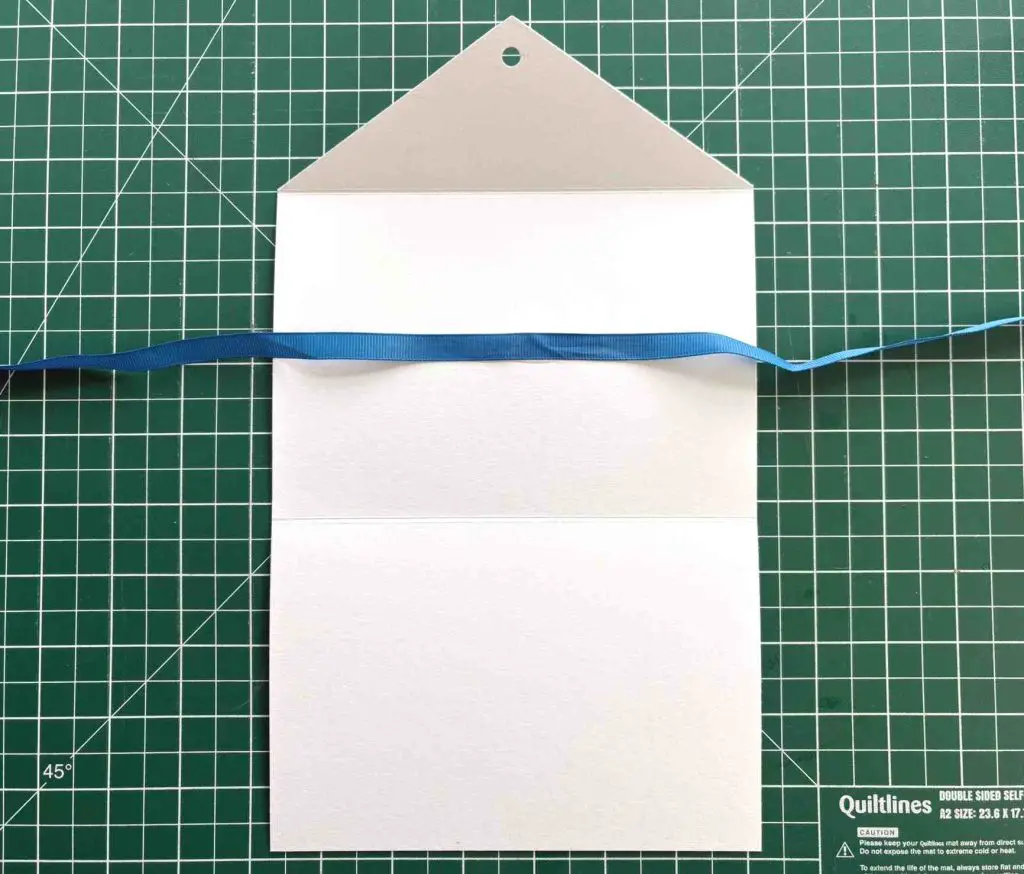 ribbon attached to invitation folder